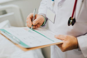 a doctor holding a medical record