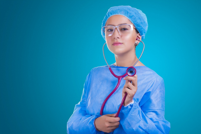 a surgeon standing in the room